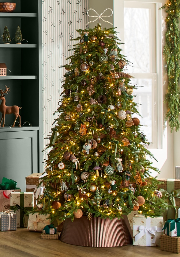 Shop festive Christmas tree ornaments including twinkling lights and tree toppers now.