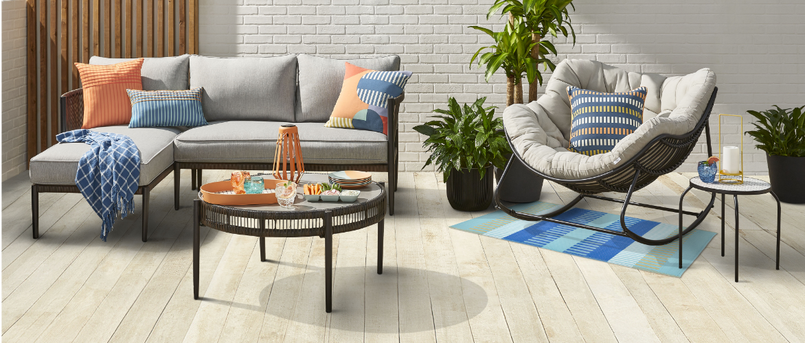 A patio sectional and coffee table dressed with Colour Spritz themed accessories.