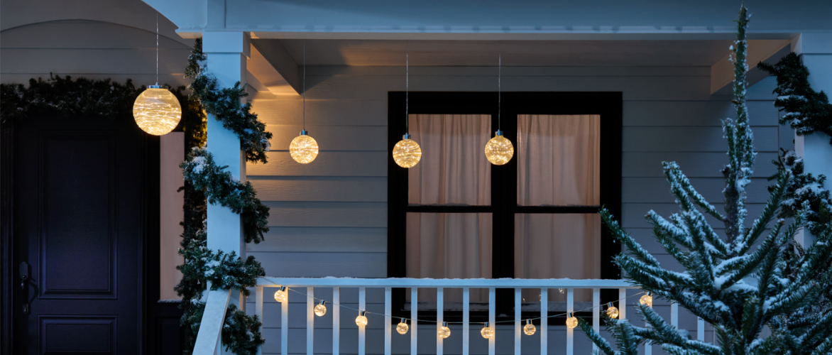 Three pre-lit CANVAS Skiing Collapsible Penguin decorations in a snowy yard.