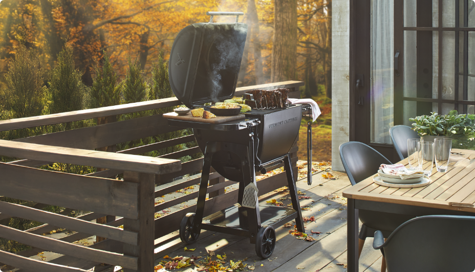 Vermont Casting Charcoal BBQ outdoors smoking meat. 