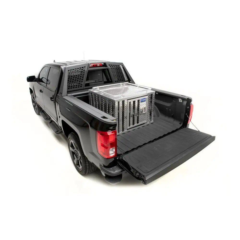 Dog crate outlet for pickup truck