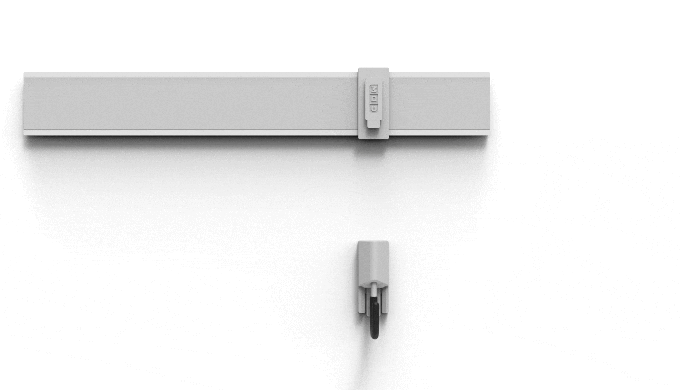 A white wall with Mastercrat MOD™ rail mount and adaptor, with a hook module below.