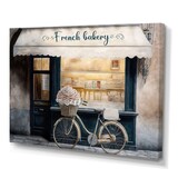 Designart Bicycle In Front a French Bakery IV Canvas Wall Art, Beige, 32-in x 24-in Front_Three_Fourths_Angled_Left