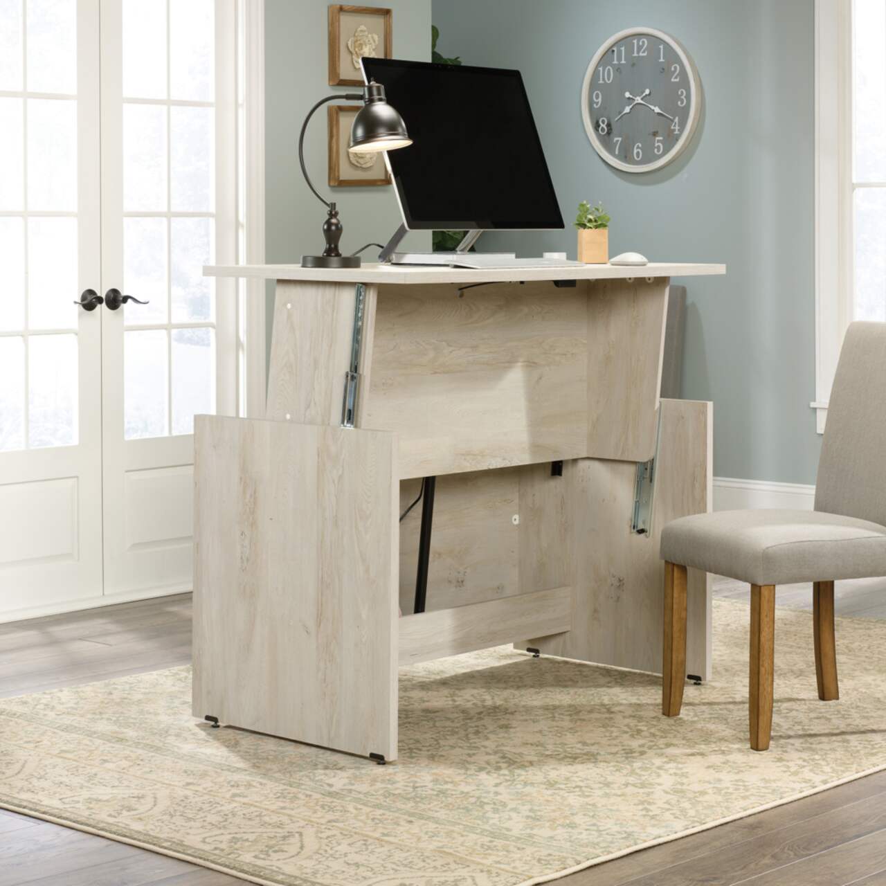 Sauder sit sales stand desk