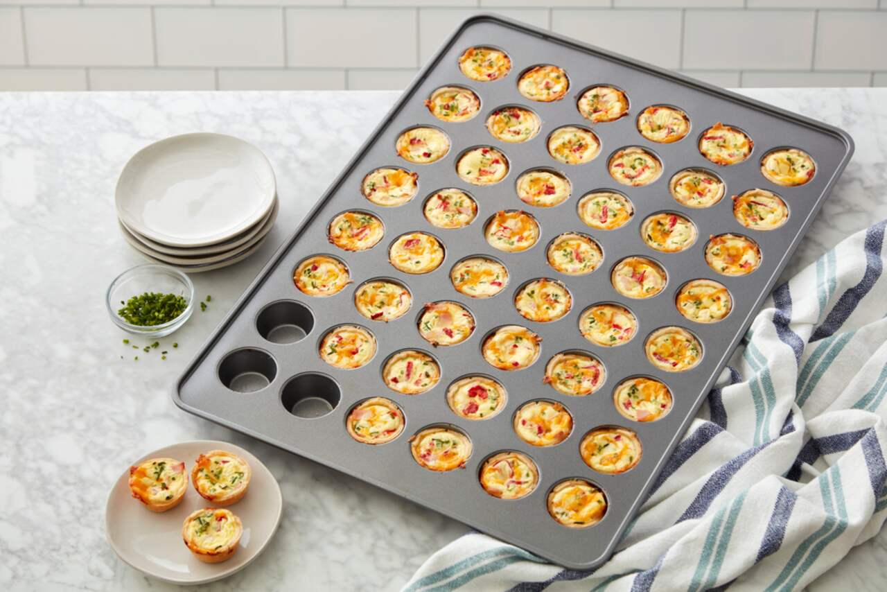 https://media-www.canadiantire.ca/product/living/kitchen/bakeware-baking-prep/1429067/wilton-mega-48-cup-mini-muffin-pan-502a0007-483e-4dd1-989c-956b8ba054d0.png?imdensity=1&imwidth=1244&impolicy=mZoom