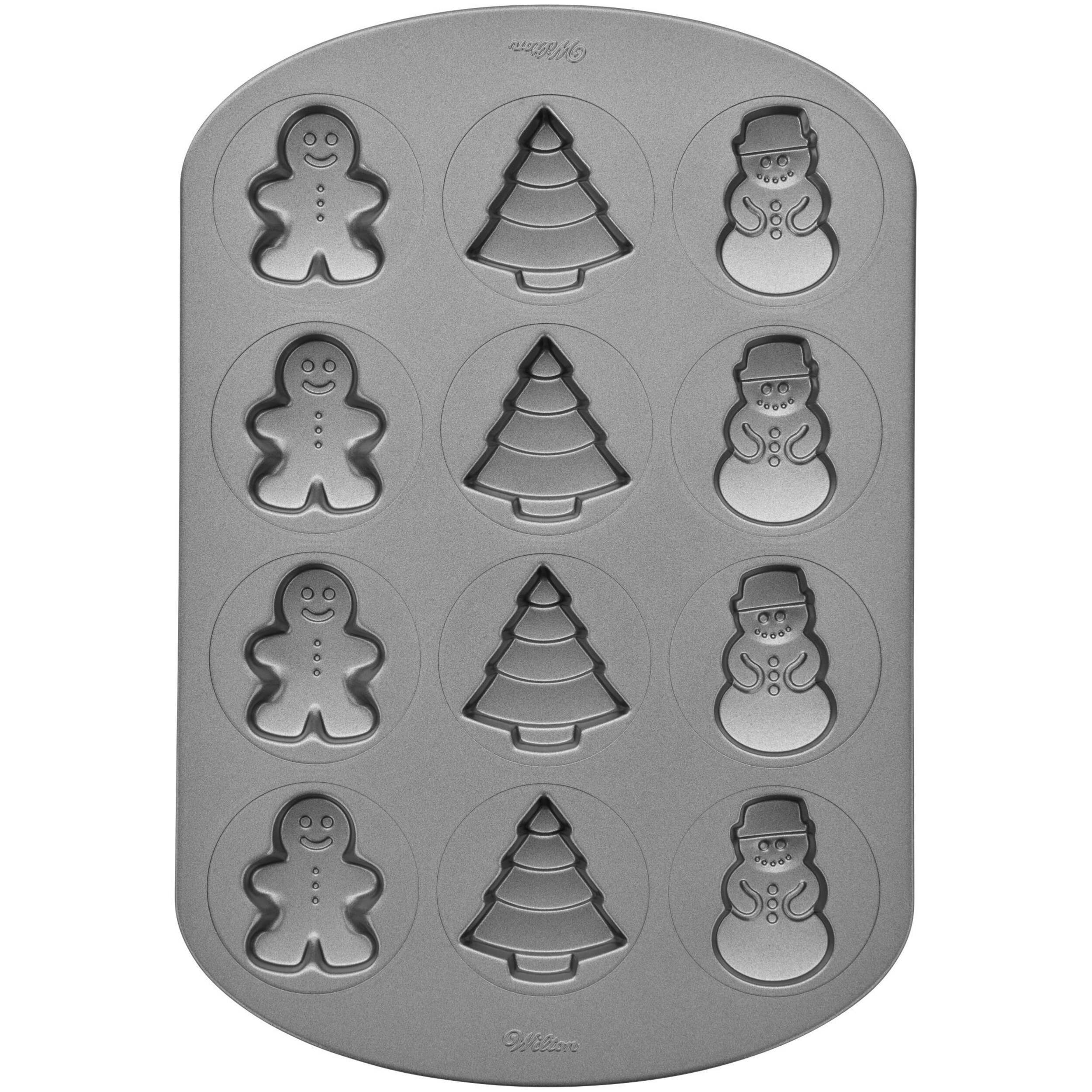 Wilton 12-Cavity Cookie Shapes Pan, Gingerbread Man, Tree, & Snowman Overhead_Flat