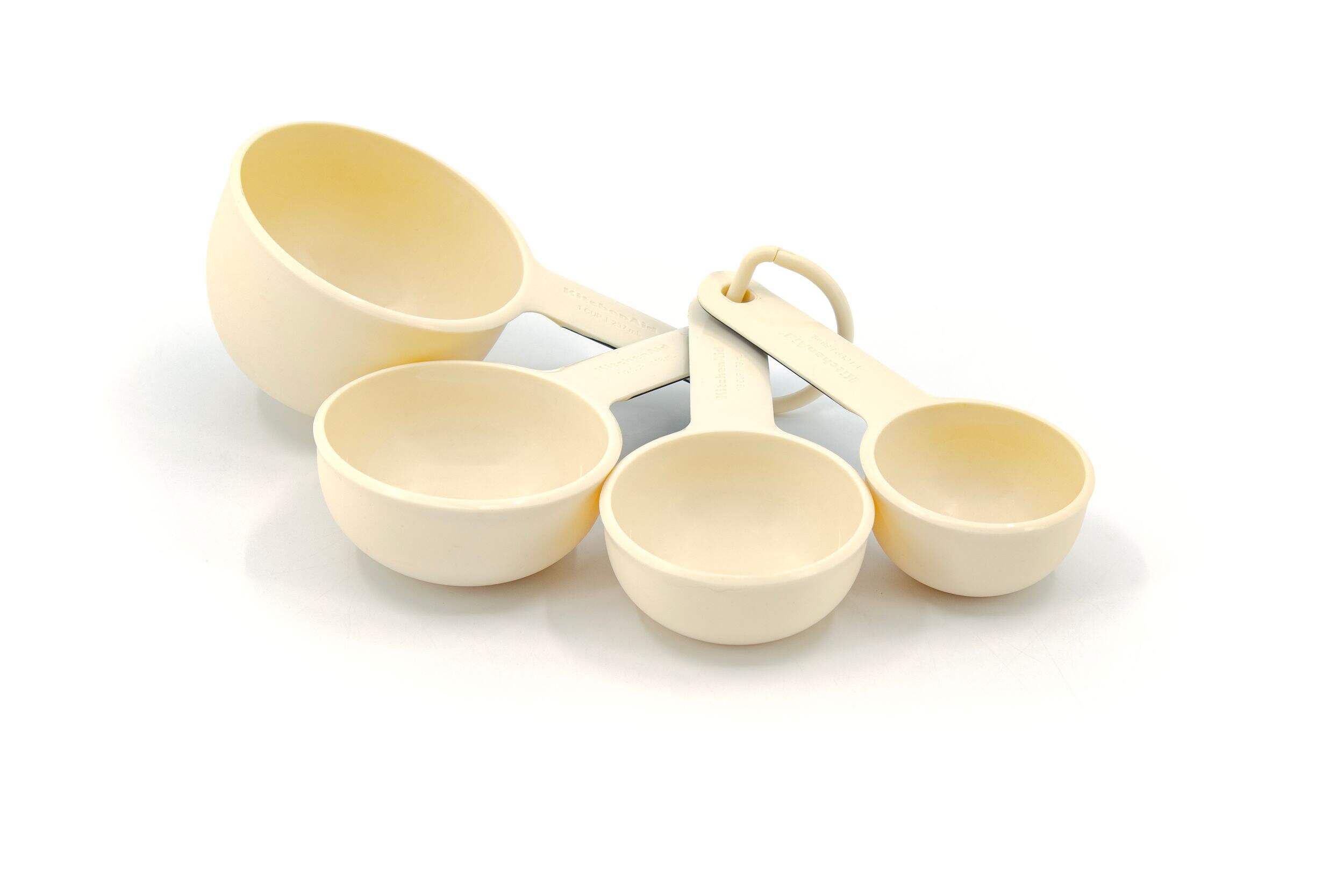 KitchenAid Plastic Measuring Cups, Almond Cream Front_Three_Fourths_Angled_Left