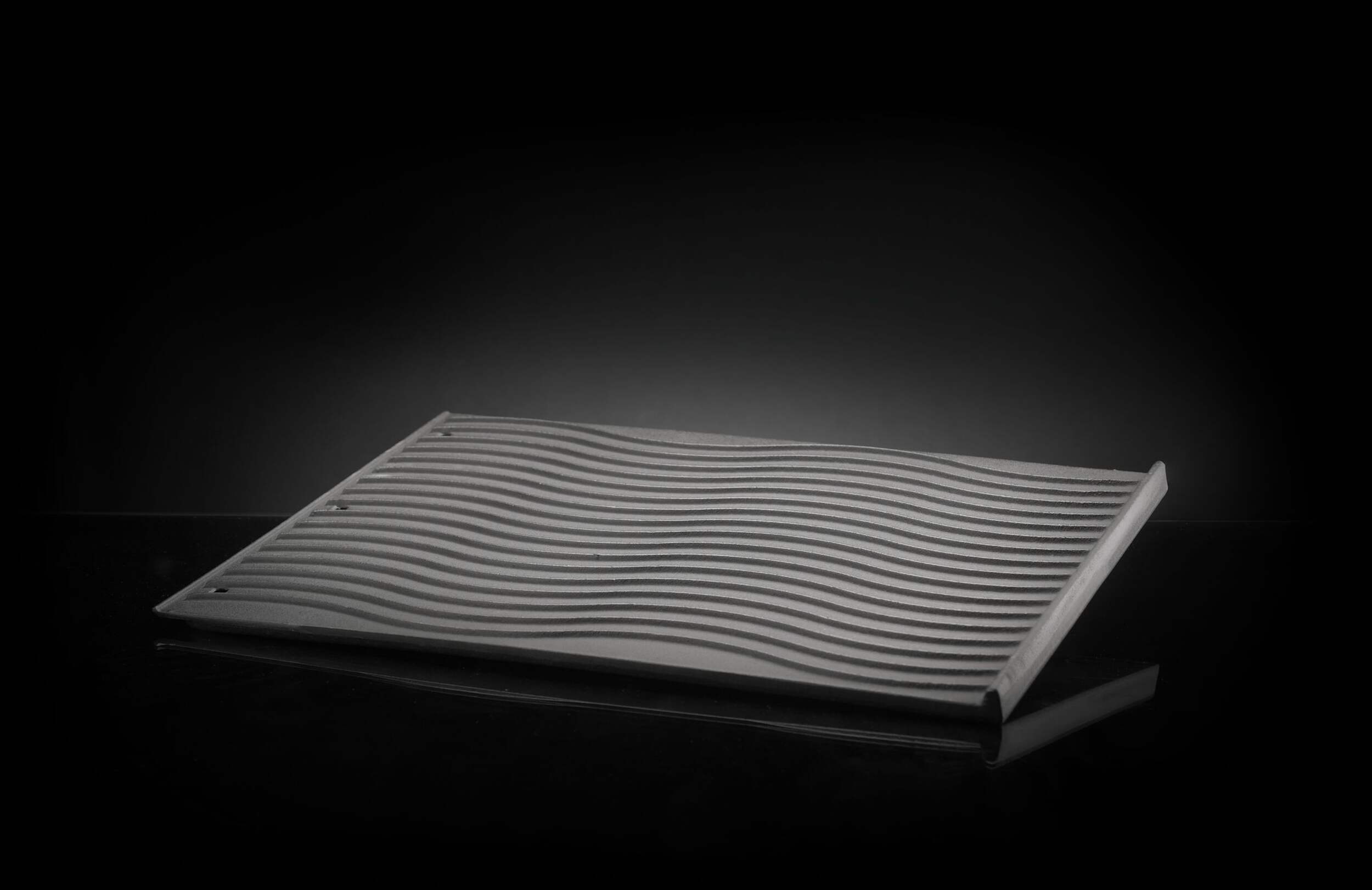 Napoleon Rebel Cast Iron Reversible Multifunctional BBQ Griddle with Integrated Holes Front_Angled_Left