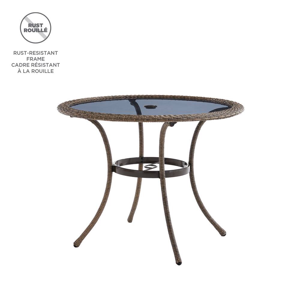 round wicker patio table with glass top