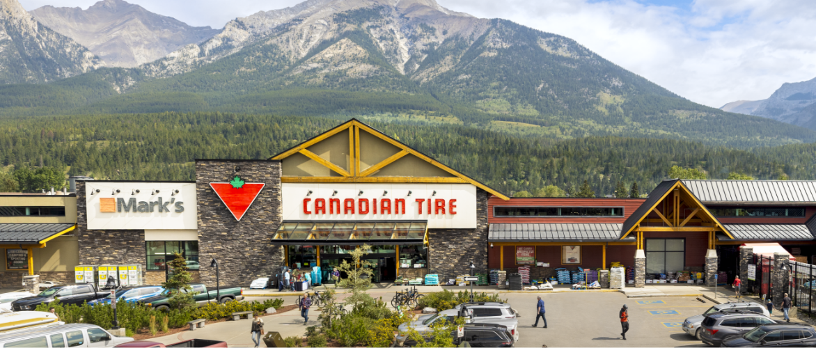 A Canadian Tire and Mark’s store side by side in a mountainous landscape in Canmore, Alberta.