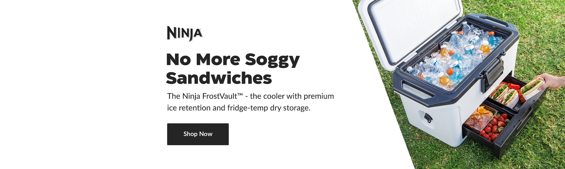 An adult grabbing a sandwich from the Dry Zone drawer of a Ninja FrostVault cooler.