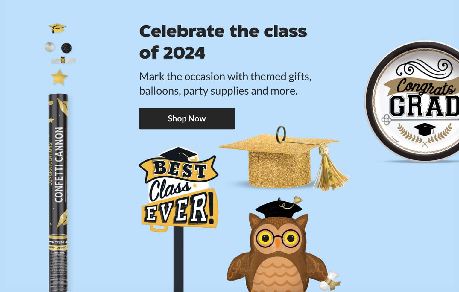 An assortment of decor items for a graduation party, including banners, serveware and stuffed toys.